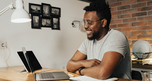 man smiling after looking at his credit score